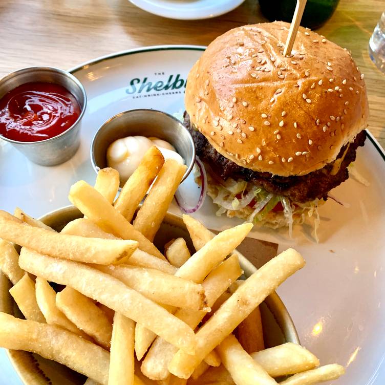 The Shelby signature dishes Nashville Hot Chicken Sandwich, The Shelby Burger, Tuna Tataki, Short Rib Pierogies
